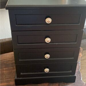 Black wooden jewelry chest with mirror and 3 drawers